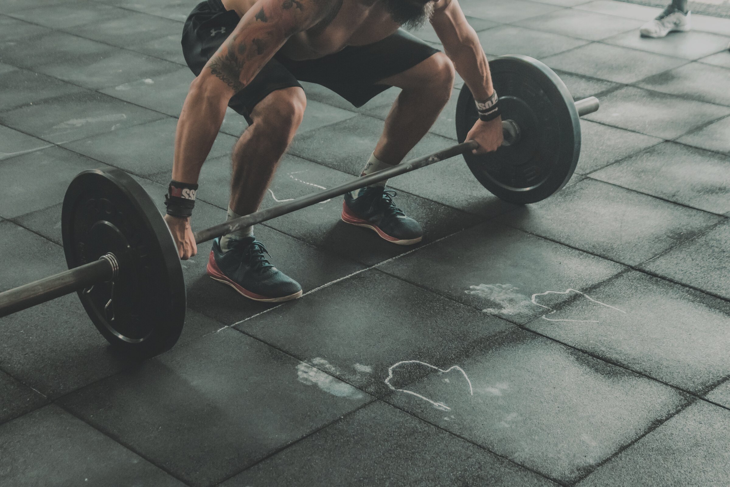 Man About to Lift Barbell